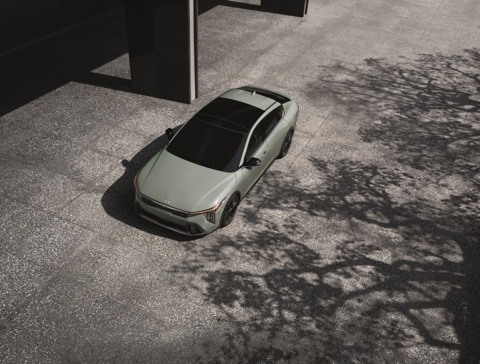Kia K4 exterior three-quarter elevated view